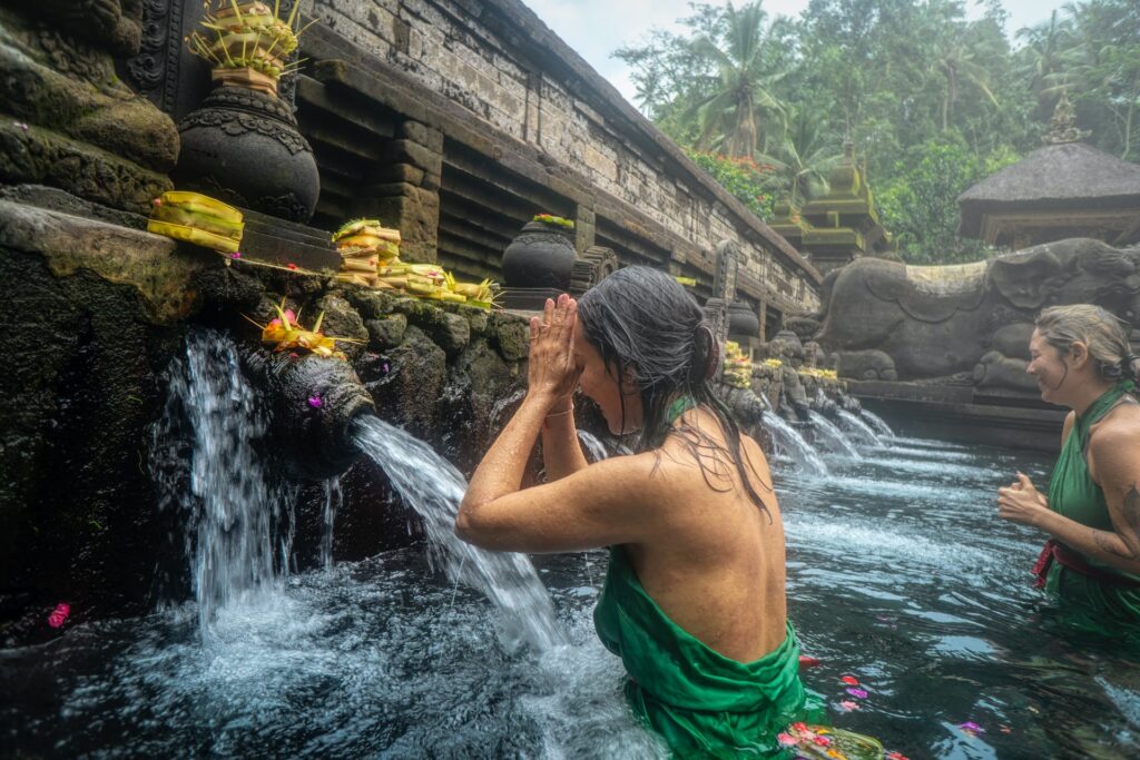 Woman doing a cleansing ritual in Bali. Source: Pexels.