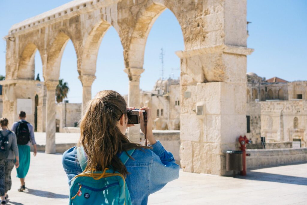 woman taking photos in israel